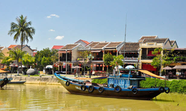 observe Hoi An ancient city from a boat on Thu Bon river