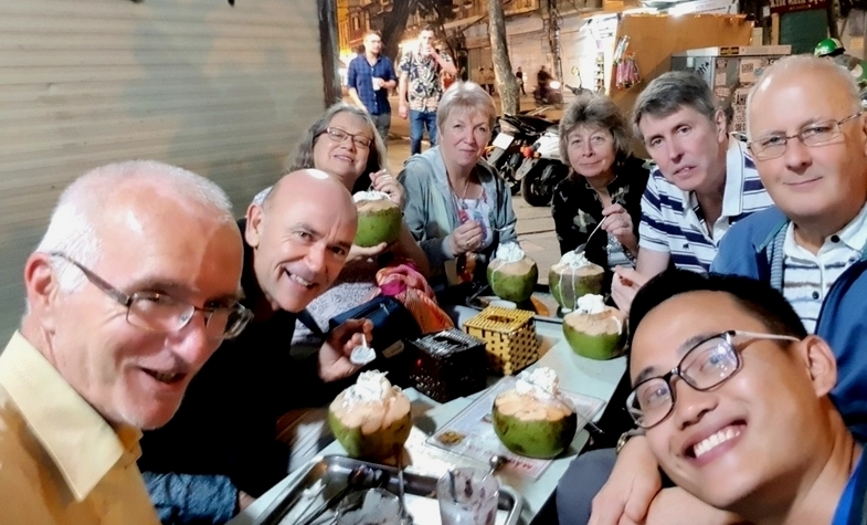 foreign tourists enjoyed night street food around Hanoi with our local expert guide