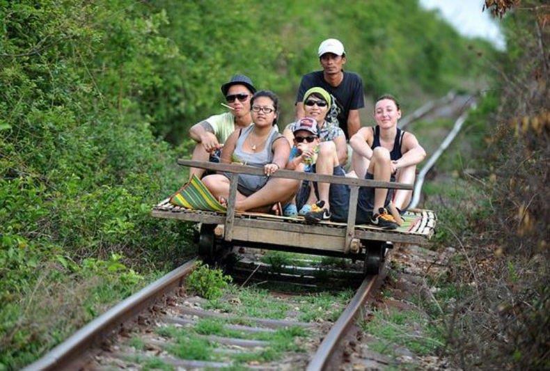 family enjoy bamboo train journey
