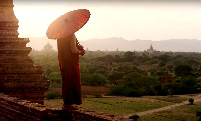  photo of a monk at sunrise from the top of Bagan temple